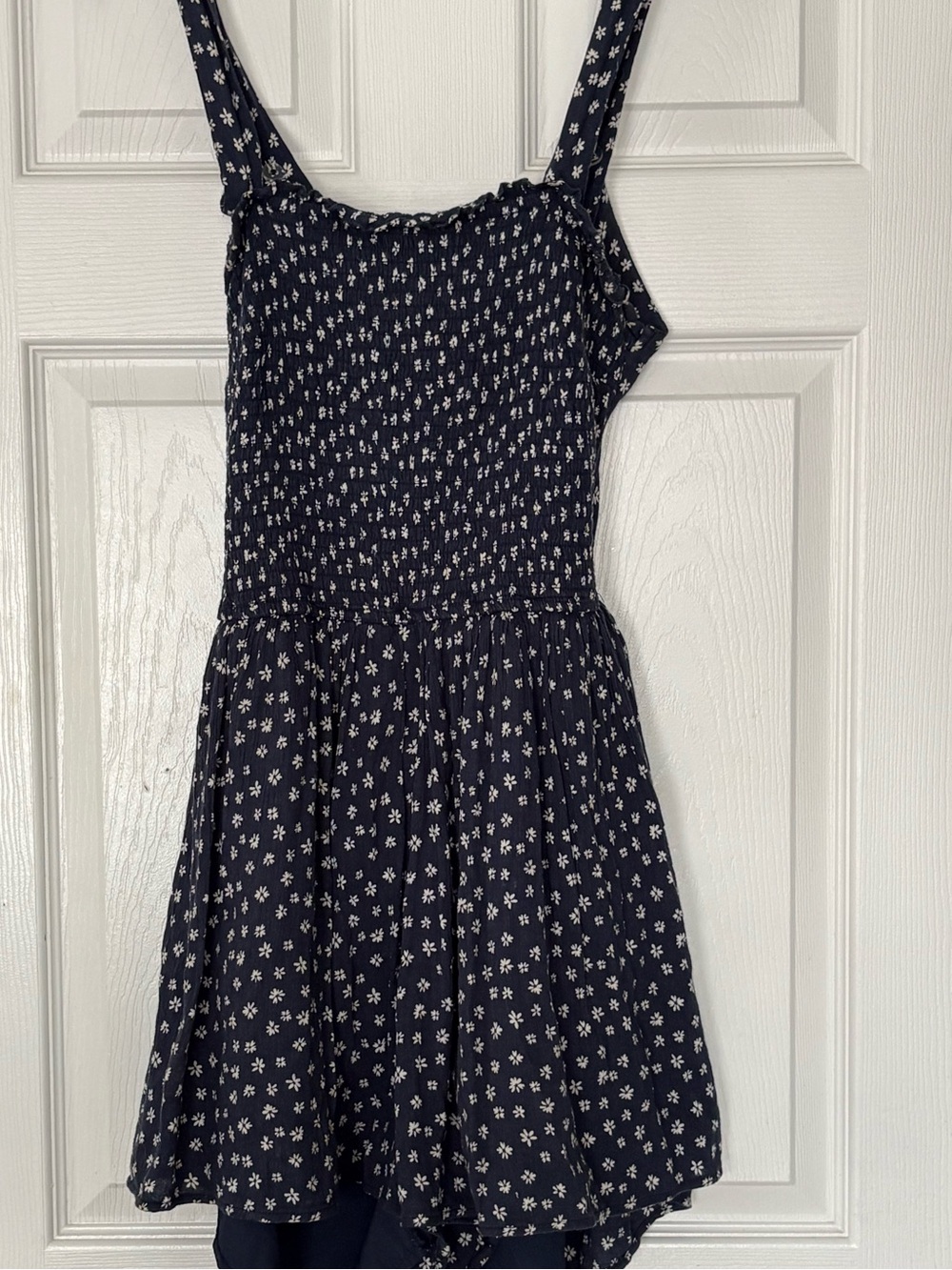 Navy blue floral smocked romper w/white daisies Large, open back